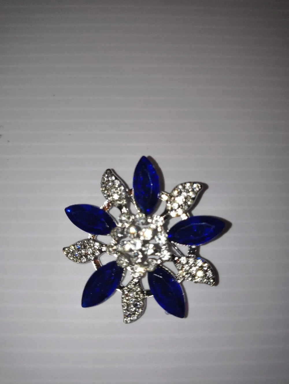 Crystal Flower Brooch with Deep Blue Marquise Stones